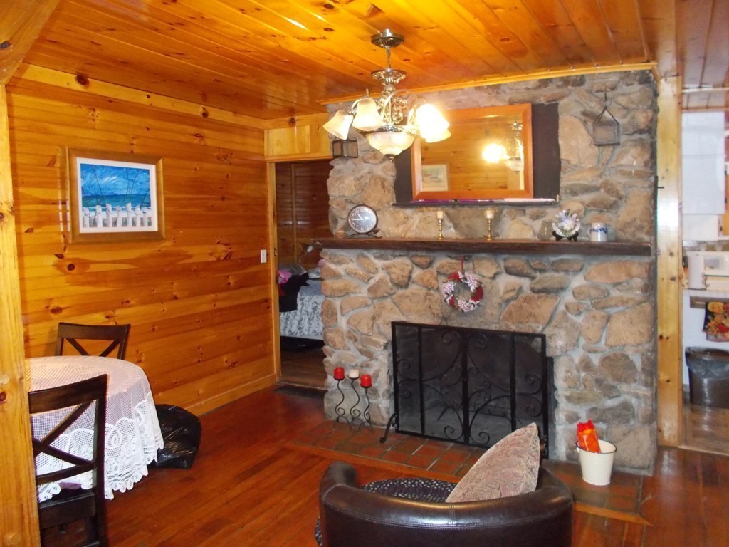 136 Barker Road Wareham, MA 02538 - Photo 6 of 13 a living room with furniture and a fireplace