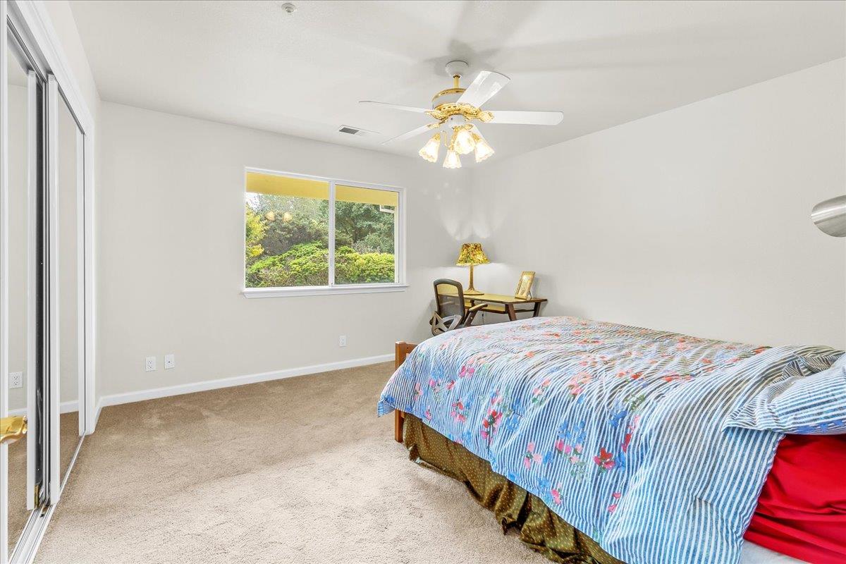 817 Lewis Road Watsonville, CA 95076 - Photo 13 of 27 a bedroom with a bed and a window