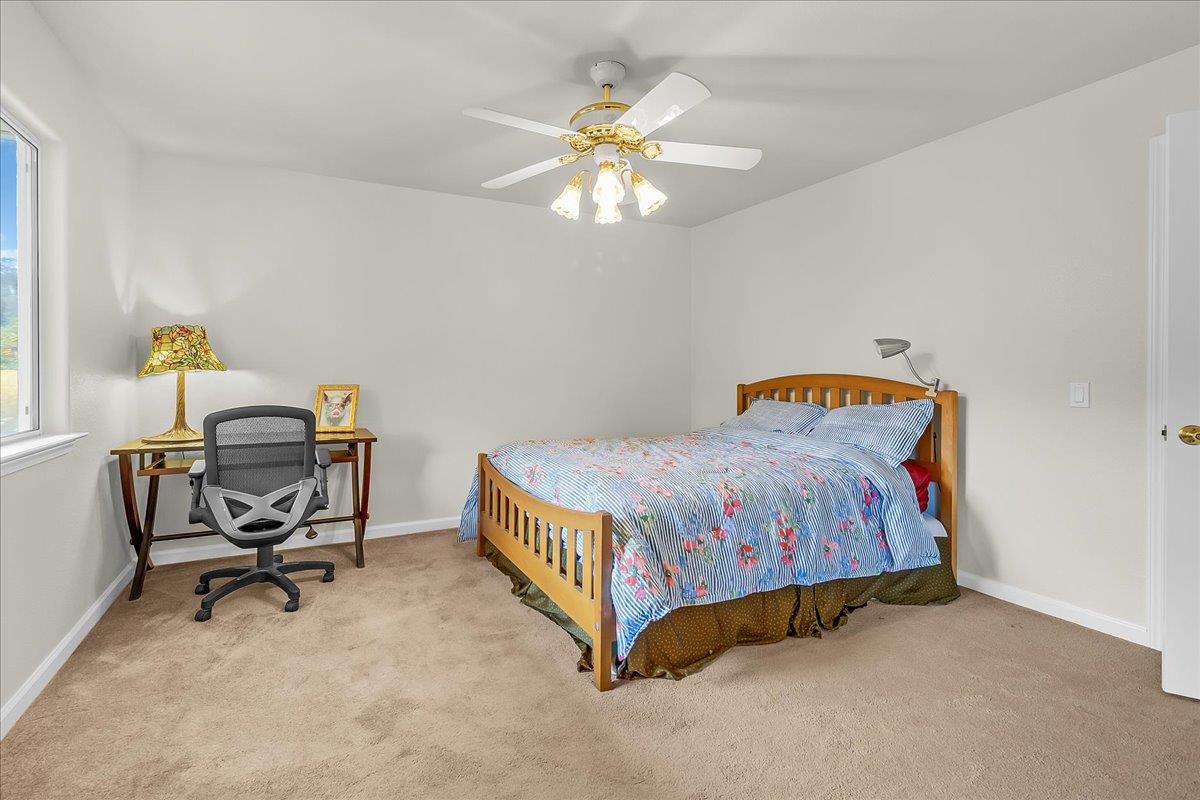 817 Lewis Road Watsonville, CA 95076 - Photo 14 of 27 a bedroom with a bed and a window