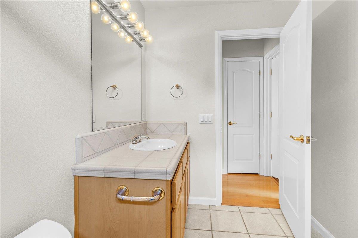 817 Lewis Road Watsonville, CA 95076 - Photo 15 of 27 a bathroom with a sink and a mirror