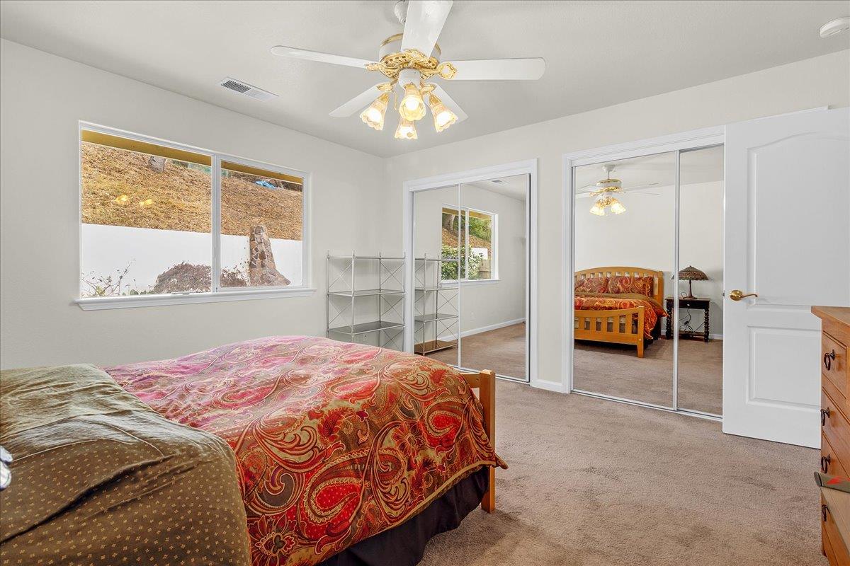 817 Lewis Road Watsonville, CA 95076 - Photo 17 of 27 a bedroom with a bed and a large window