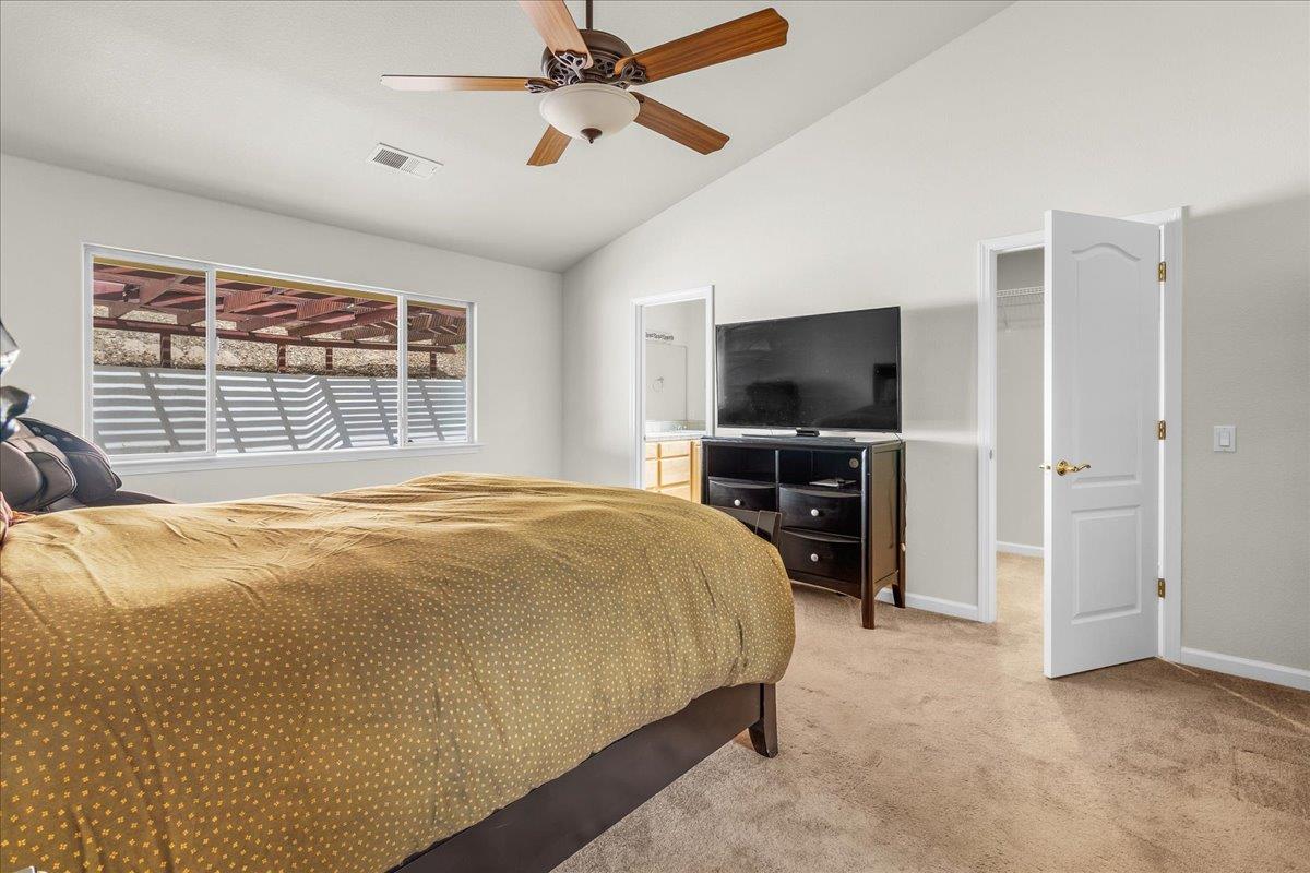 817 Lewis Road Watsonville, CA 95076 - Photo 9 of 27 a bedroom with a bed and a flat screen tv