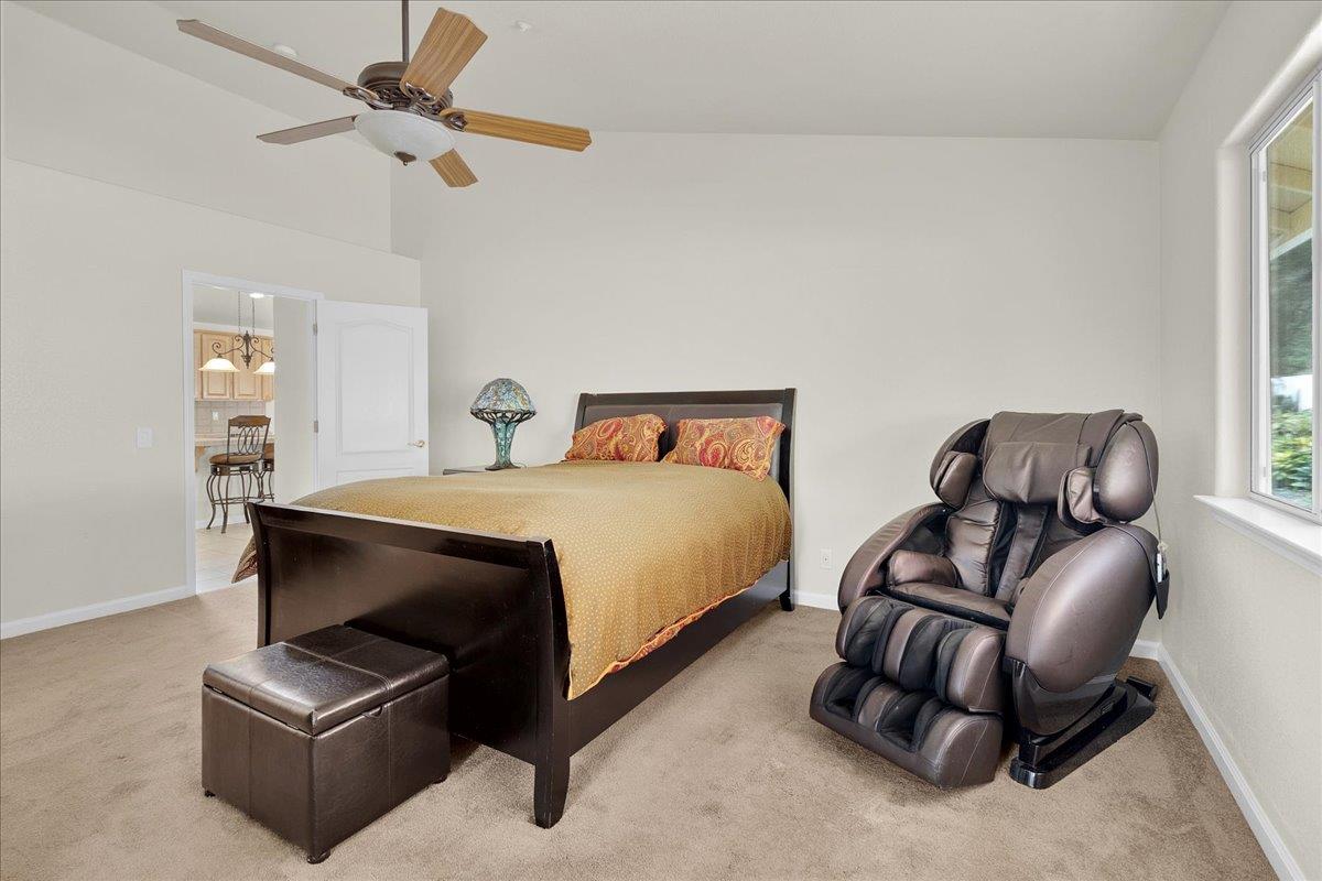 817 Lewis Road Watsonville, CA 95076 - Photo 10 of 27 a bedroom with furniture and a ceiling fan