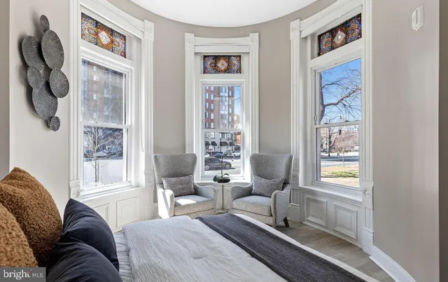 a living room with furniture and a window