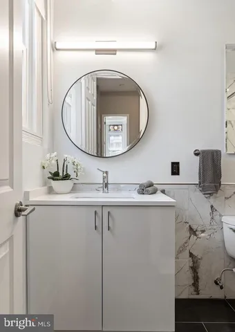 a bathroom with a sink and mirror