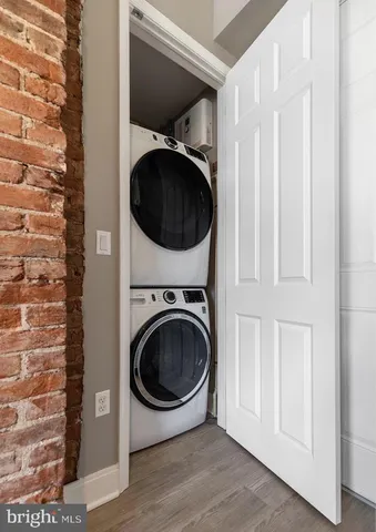 a view of a hallway with washer and dryer