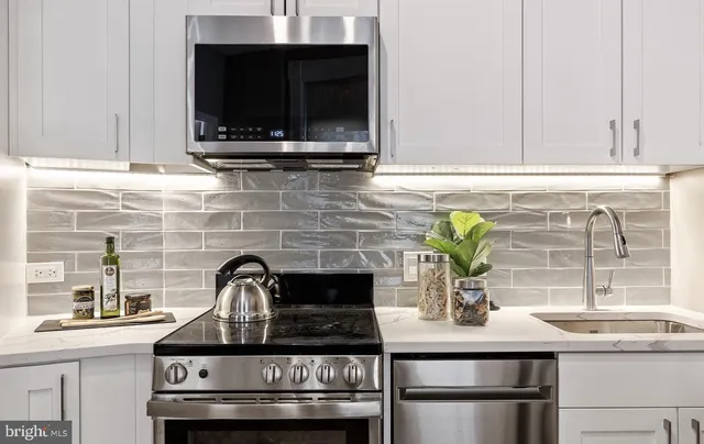 a kitchen with a stove and a sink