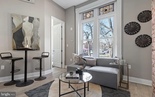 a living room with furniture and a window