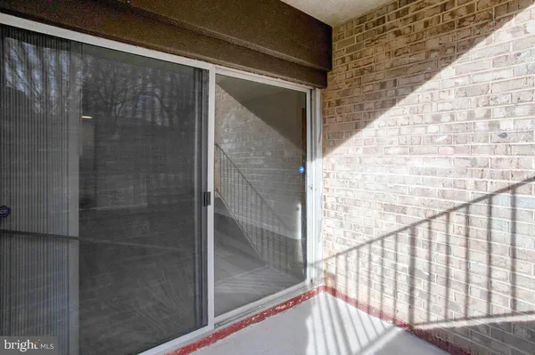 a view of balcony with wooden floor