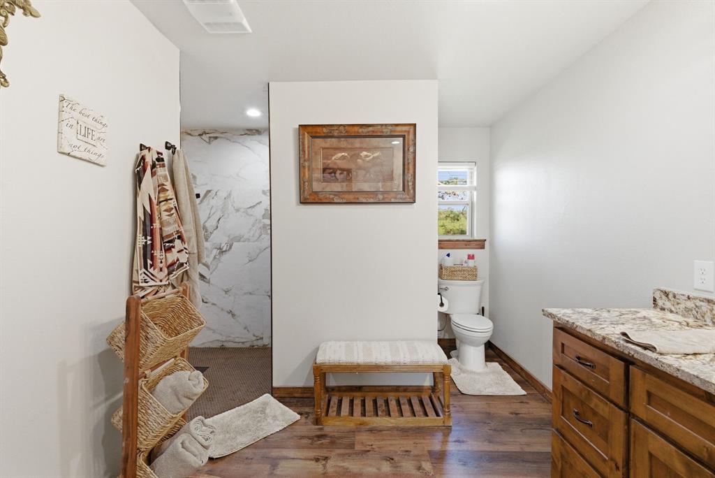 187 County Road 4195 Decatur, TX 76234 - Photo 20 of 40 a bathroom with a toilet and a shower