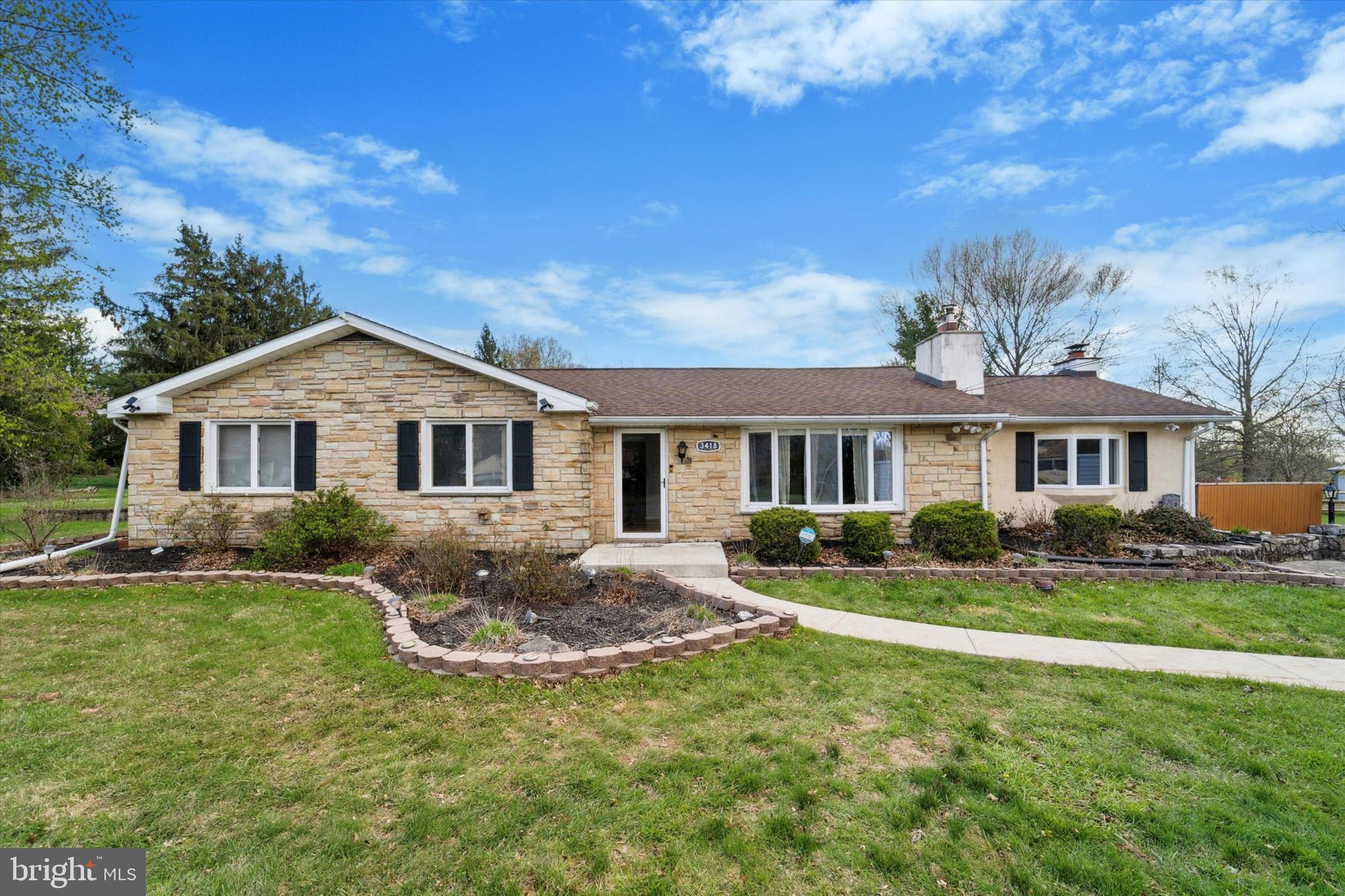 3418 Mill Road Collegeville, PA 19426 - Photo 1 of 35 a front view of a house with a yard and porch