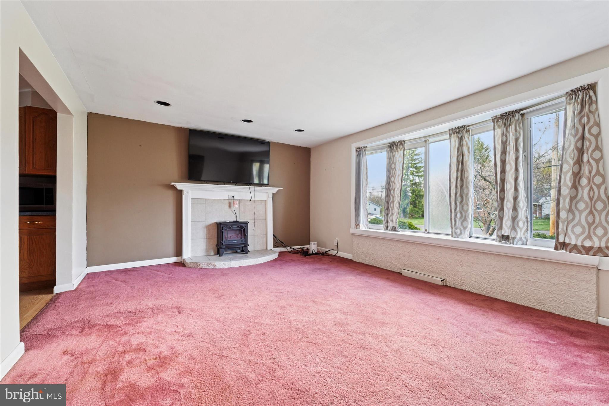 3418 Mill Road Collegeville, PA 19426 - Photo 11 of 35 a view of empty room with a fireplace