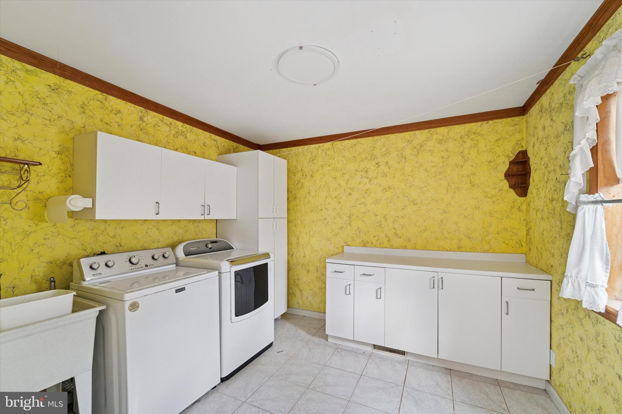 3418 Mill Road Collegeville, PA 19426 - Photo 17 of 35 a utility room with cabinets washer and dryer
