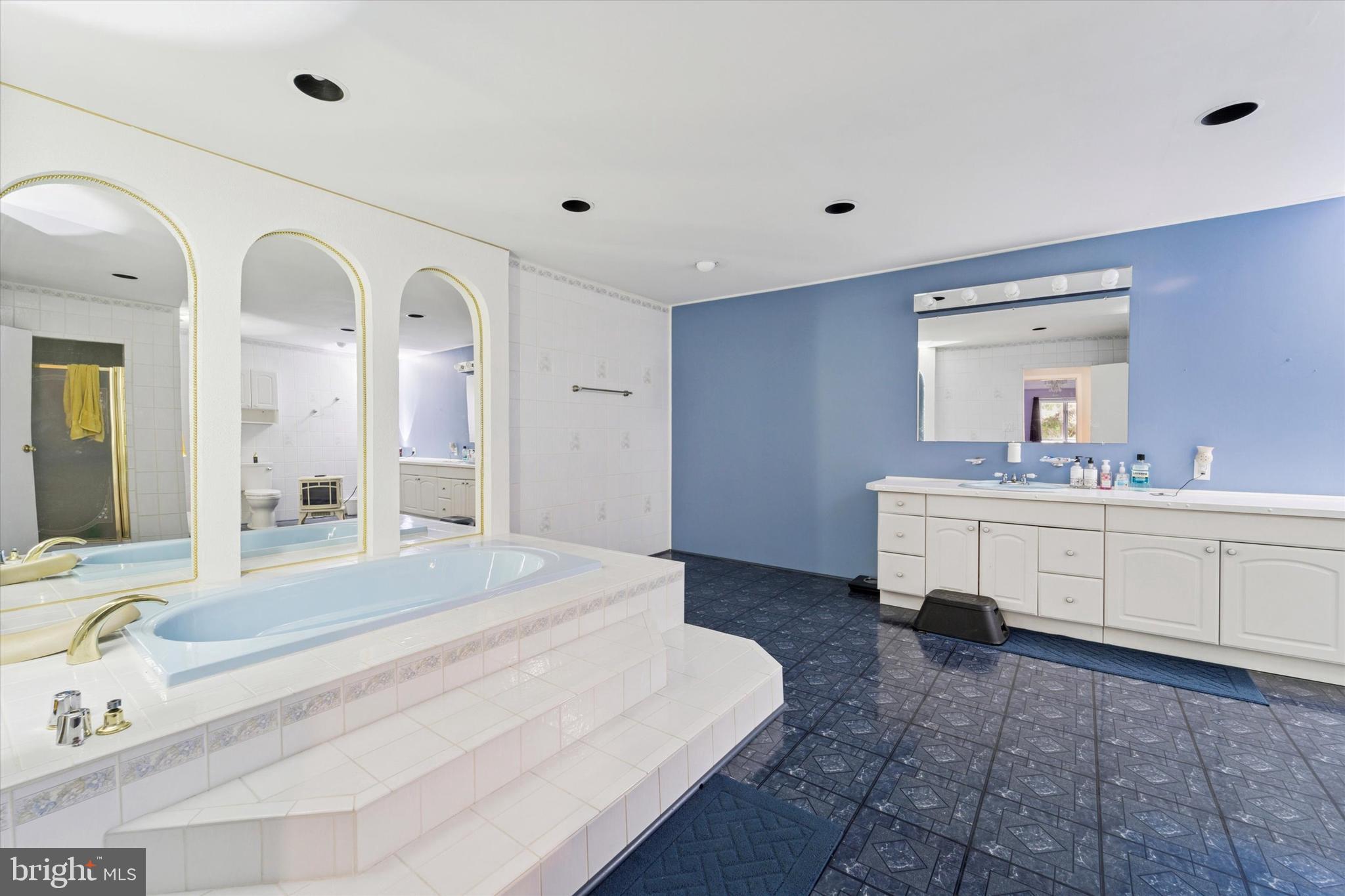 3418 Mill Road Collegeville, PA 19426 - Photo 23 of 35 a spacious bathroom with a double vanity sink mirror and