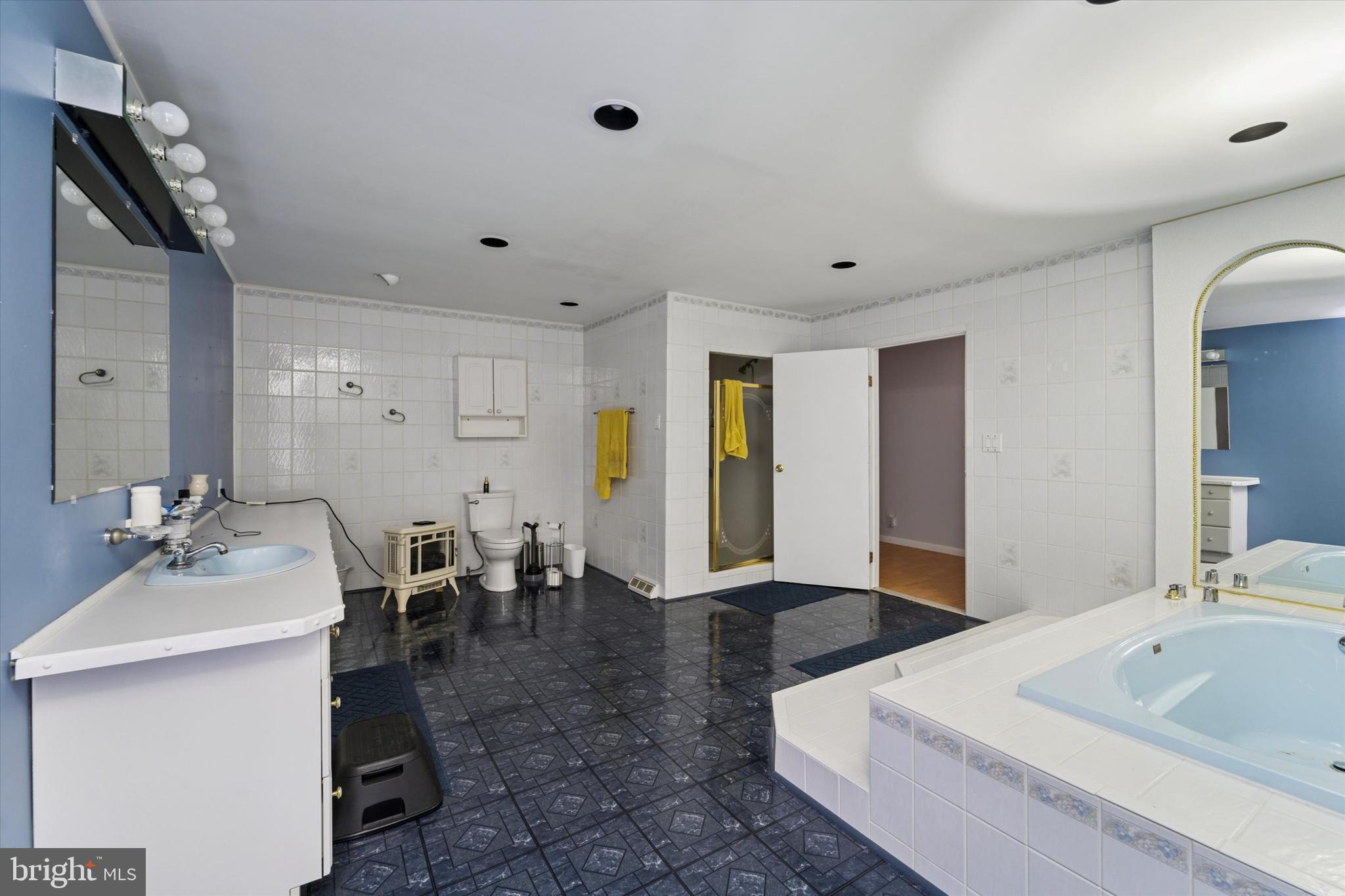 3418 Mill Road Collegeville, PA 19426 - Photo 24 of 35 a spacious bathroom with a double vanity sink and a bathtub