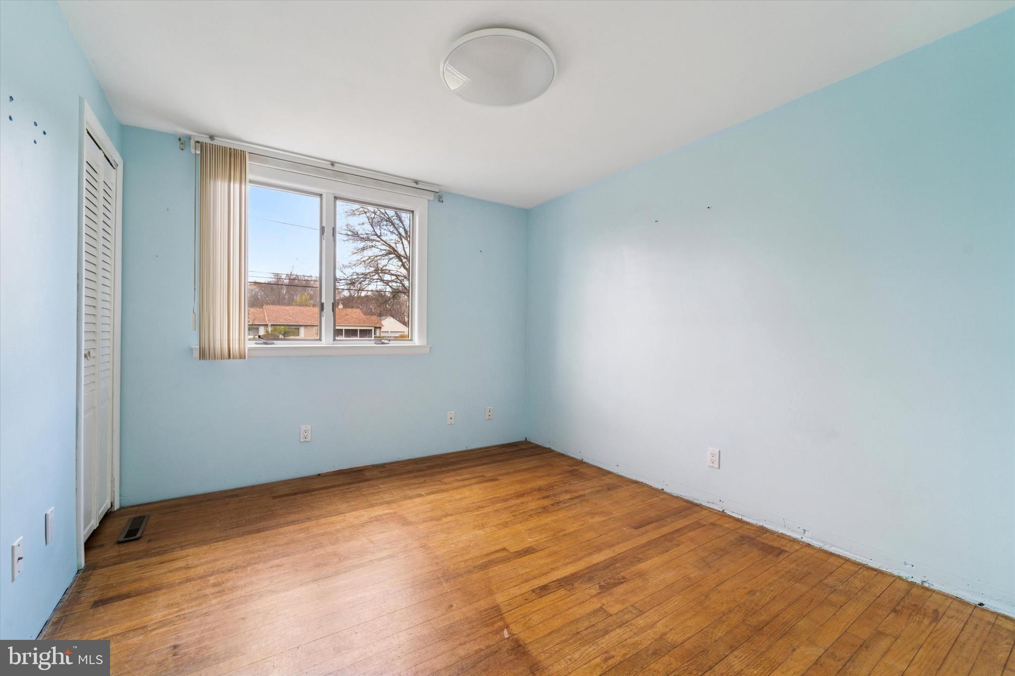 3418 Mill Road Collegeville, PA 19426 - Photo 25 of 35 a view of an empty room with wooden floor and a window