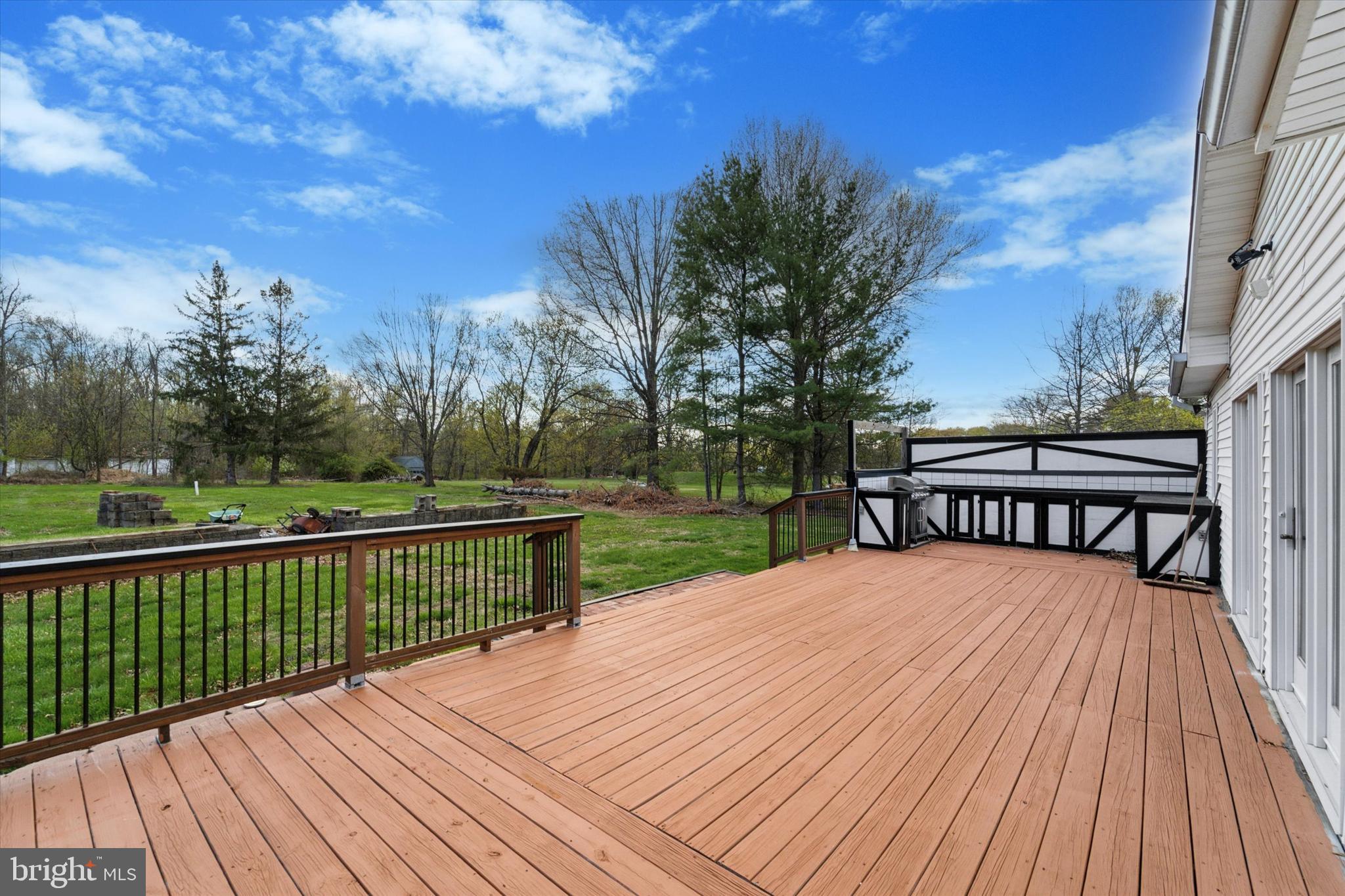 3418 Mill Road Collegeville, PA 19426 - Photo 28 of 35 a view of a wooden deck with a yard