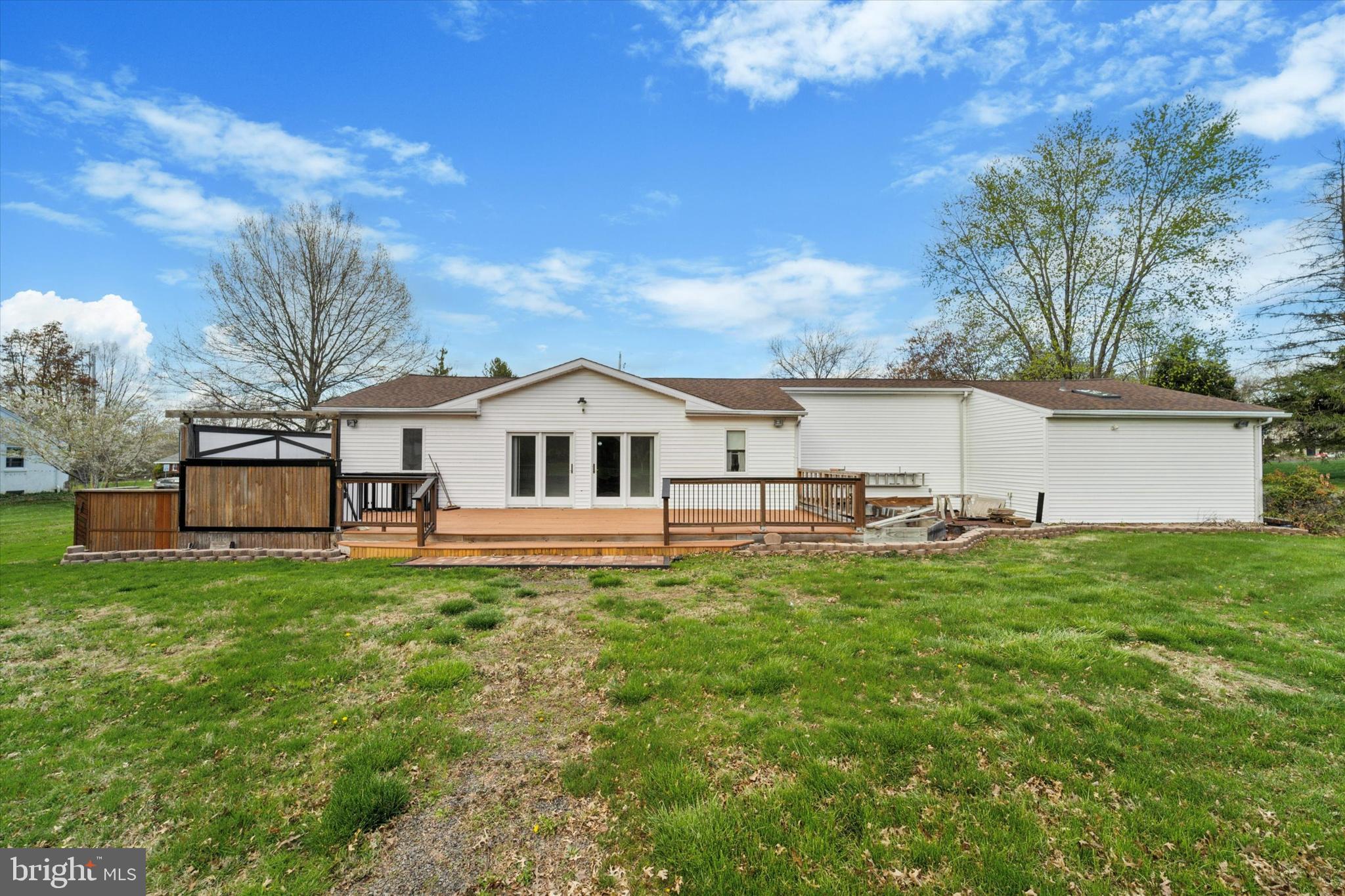 3418 Mill Road Collegeville, PA 19426 - Photo 29 of 35 a white house with a yard and large trees