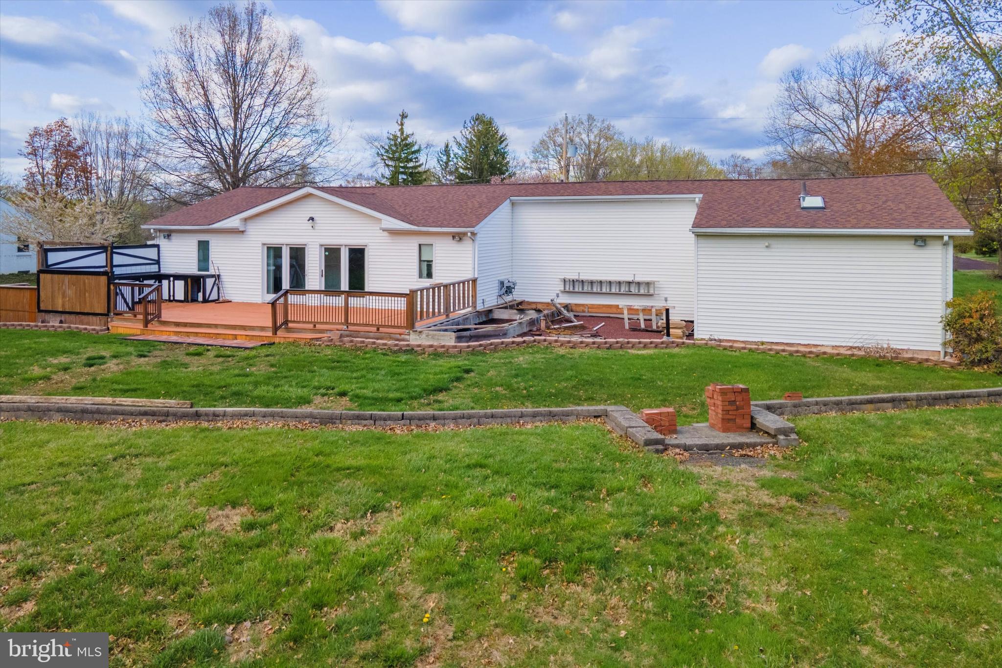 3418 Mill Road Collegeville, PA 19426 - Photo 35 of 35 a front view of house with a garden and patio