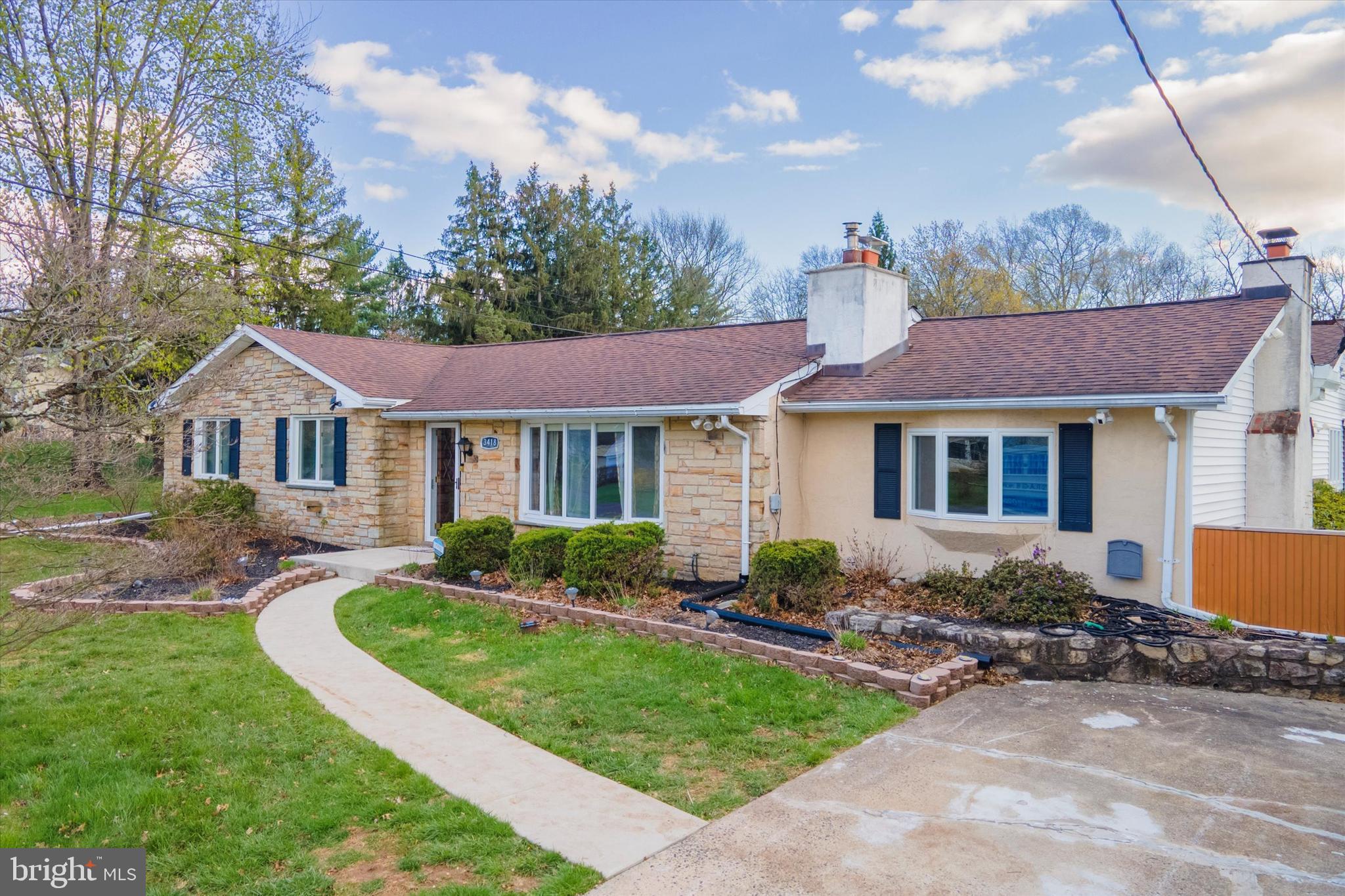 3418 Mill Road Collegeville, PA 19426 - Photo 8 of 35 a front view of a house with garden