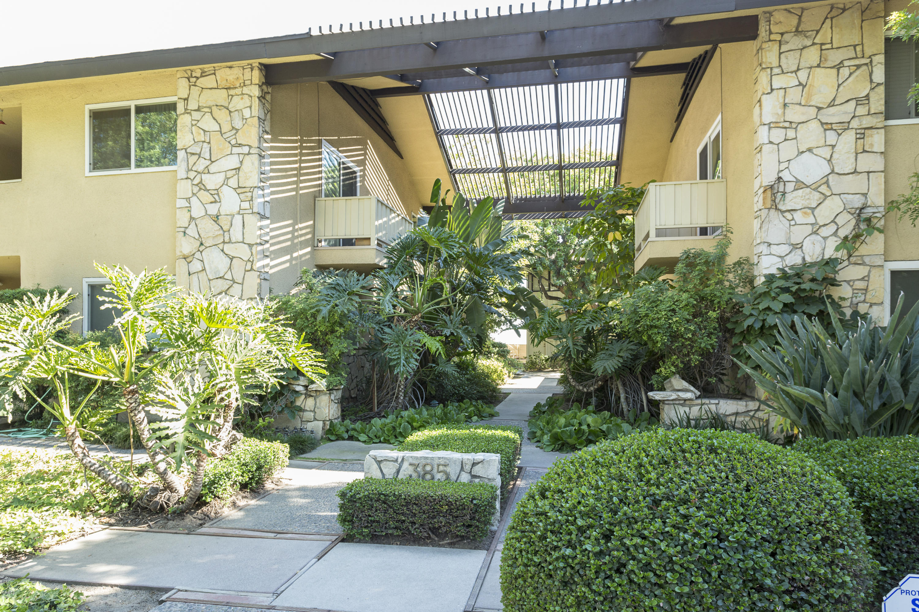 385 Cliff Drive, Unit 3 Pasadena, CA 91107 - Photo 13 of 13 a front view of a house with a garden
