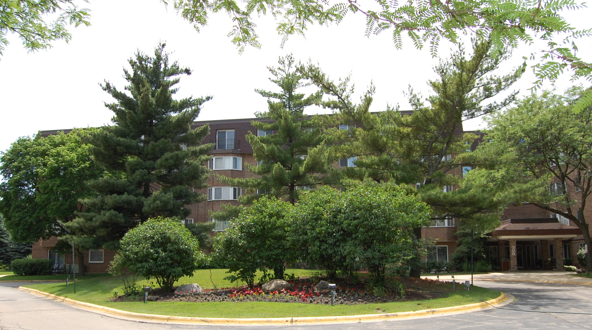 300 South Roselle Road, Unit 507 Schaumburg, IL 60193 - Photo 1 of 19 a front view of a house with yard and green space