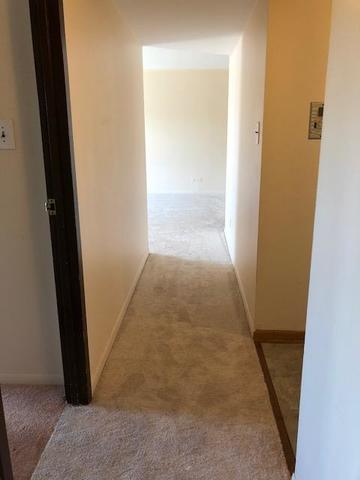 300 South Roselle Road, Unit 507 Schaumburg, IL 60193 - Photo 12 of 19 an entryway door with a hallway in the house