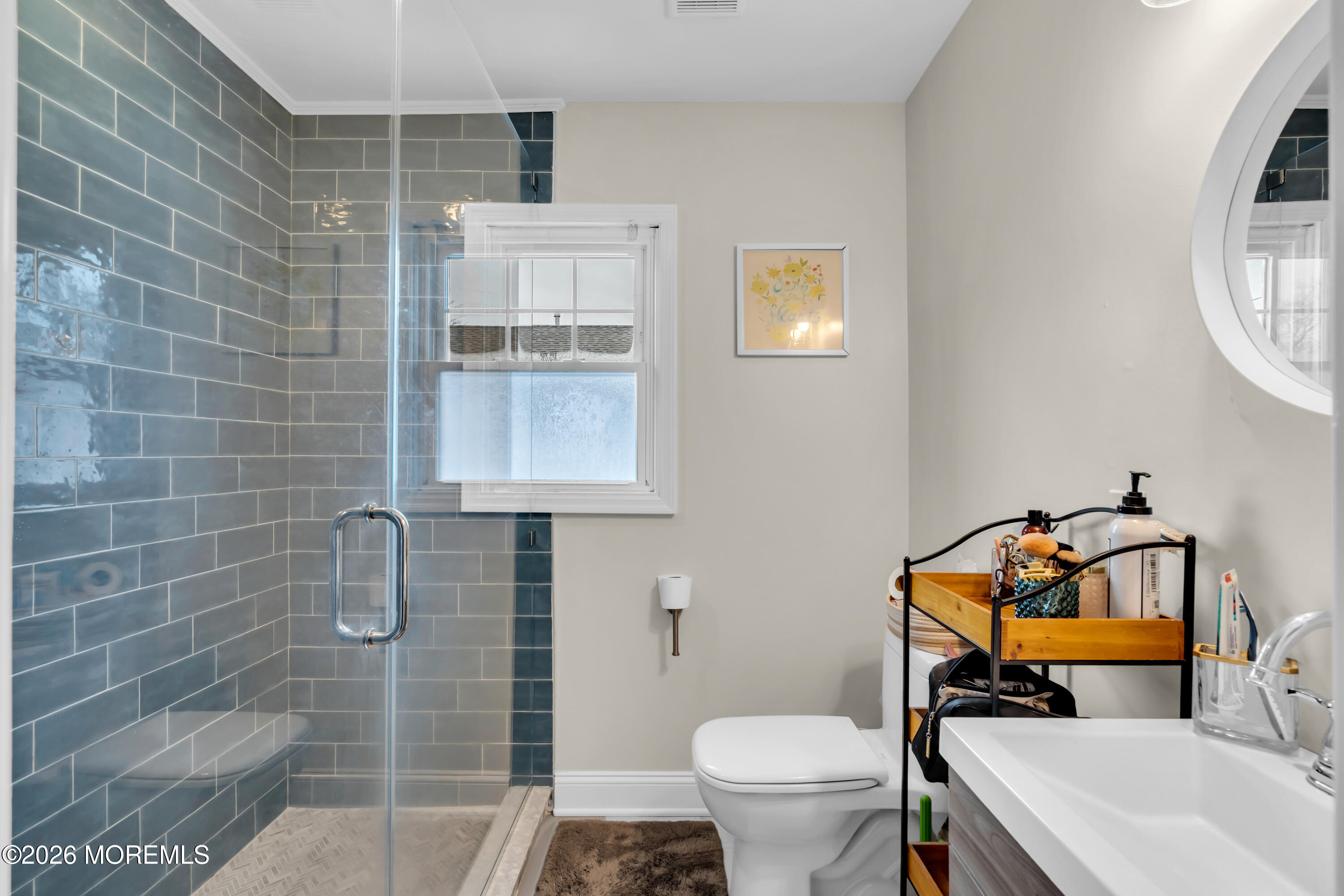 1215 Lister Street, Unit B Point Pleasant, NJ 08742 - Photo 14 of 16 a bathroom with a sink toilet and shower