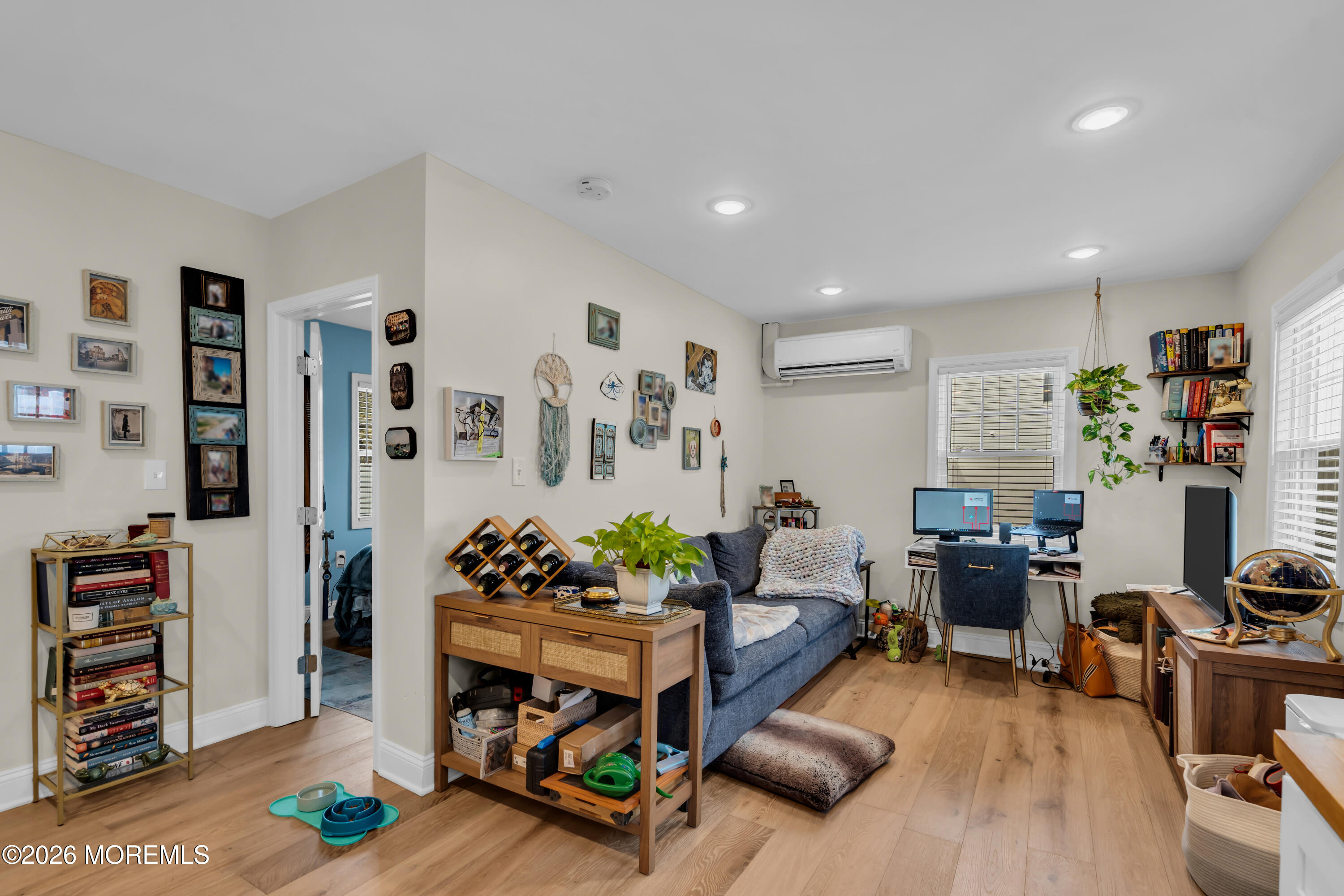 1215 Lister Street, Unit B Point Pleasant, NJ 08742 - Photo 5 of 16 a living room with furniture and a book shelf