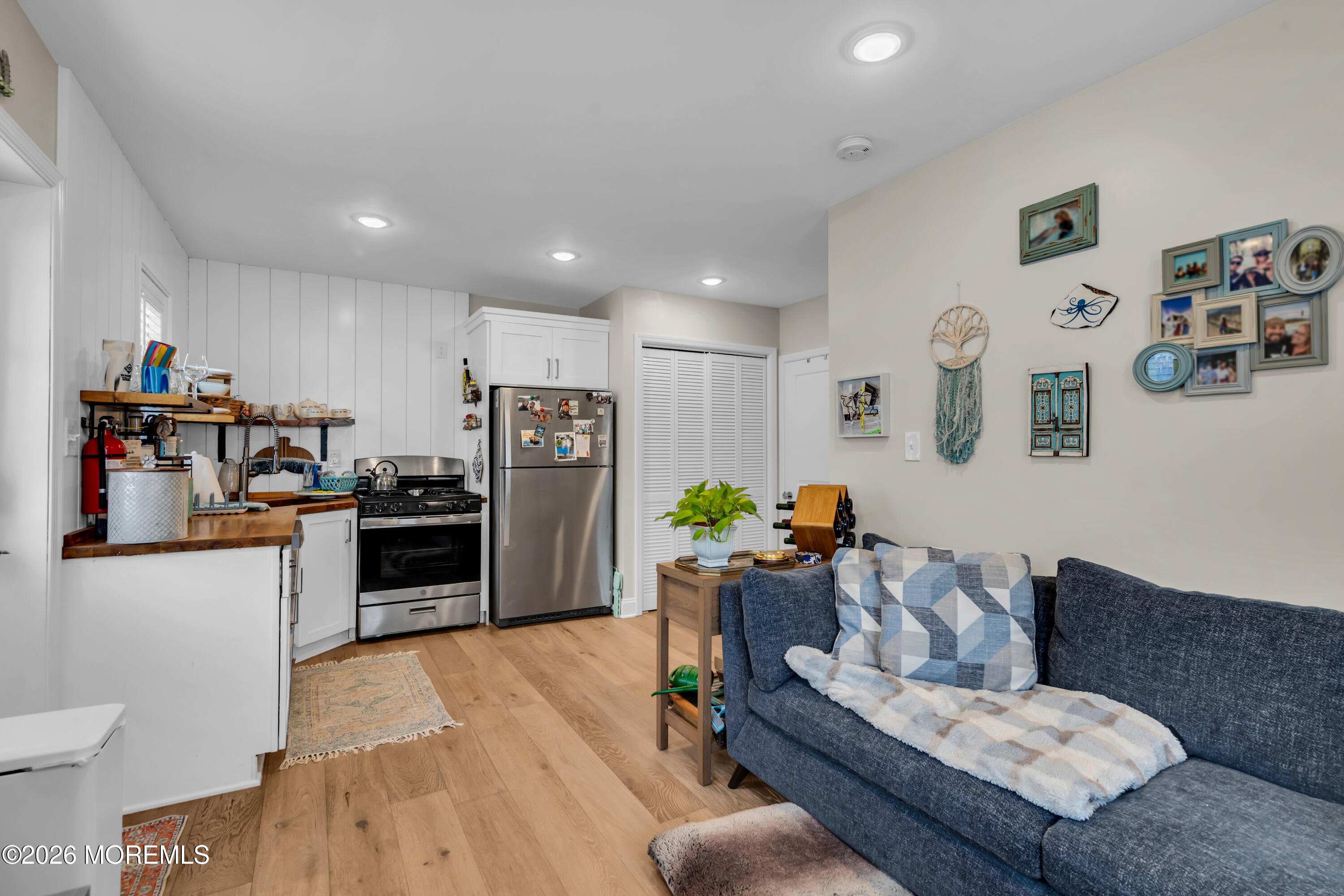 1215 Lister Street, Unit B Point Pleasant, NJ 08742 - Photo 8 of 16 a living room with furniture and kitchen view