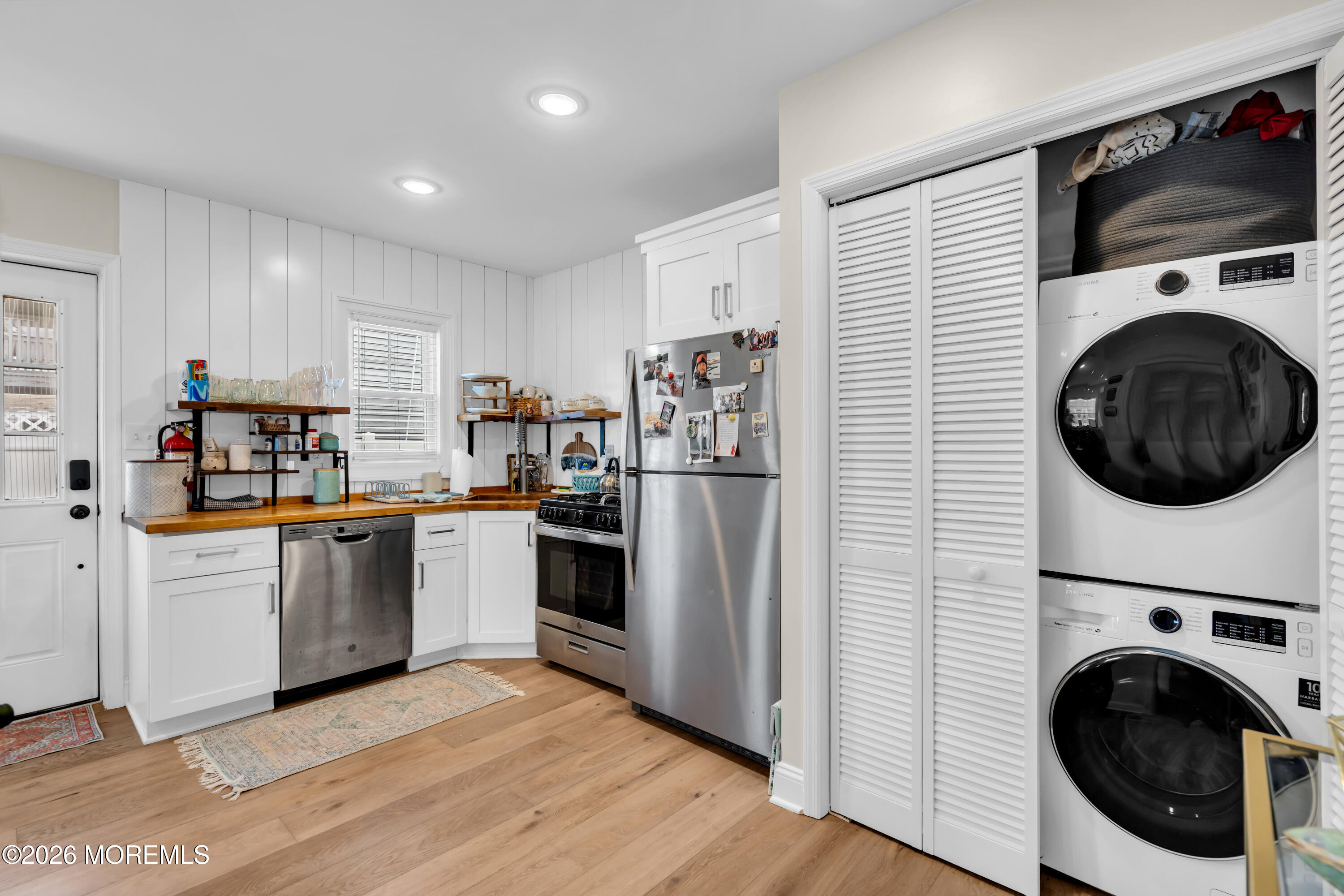 1215 Lister Street, Unit B Point Pleasant, NJ 08742 - Photo 10 of 16 a kitchen with stainless steel appliances a refrigerator a stove top oven a sink and cabinets