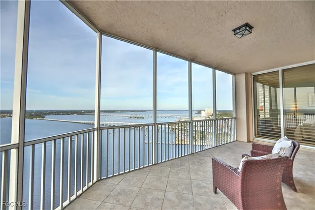 a view of a balcony with furniture