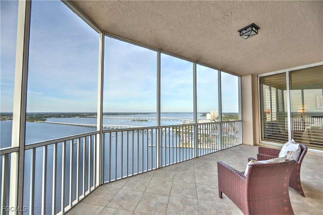 a view of a balcony with furniture
