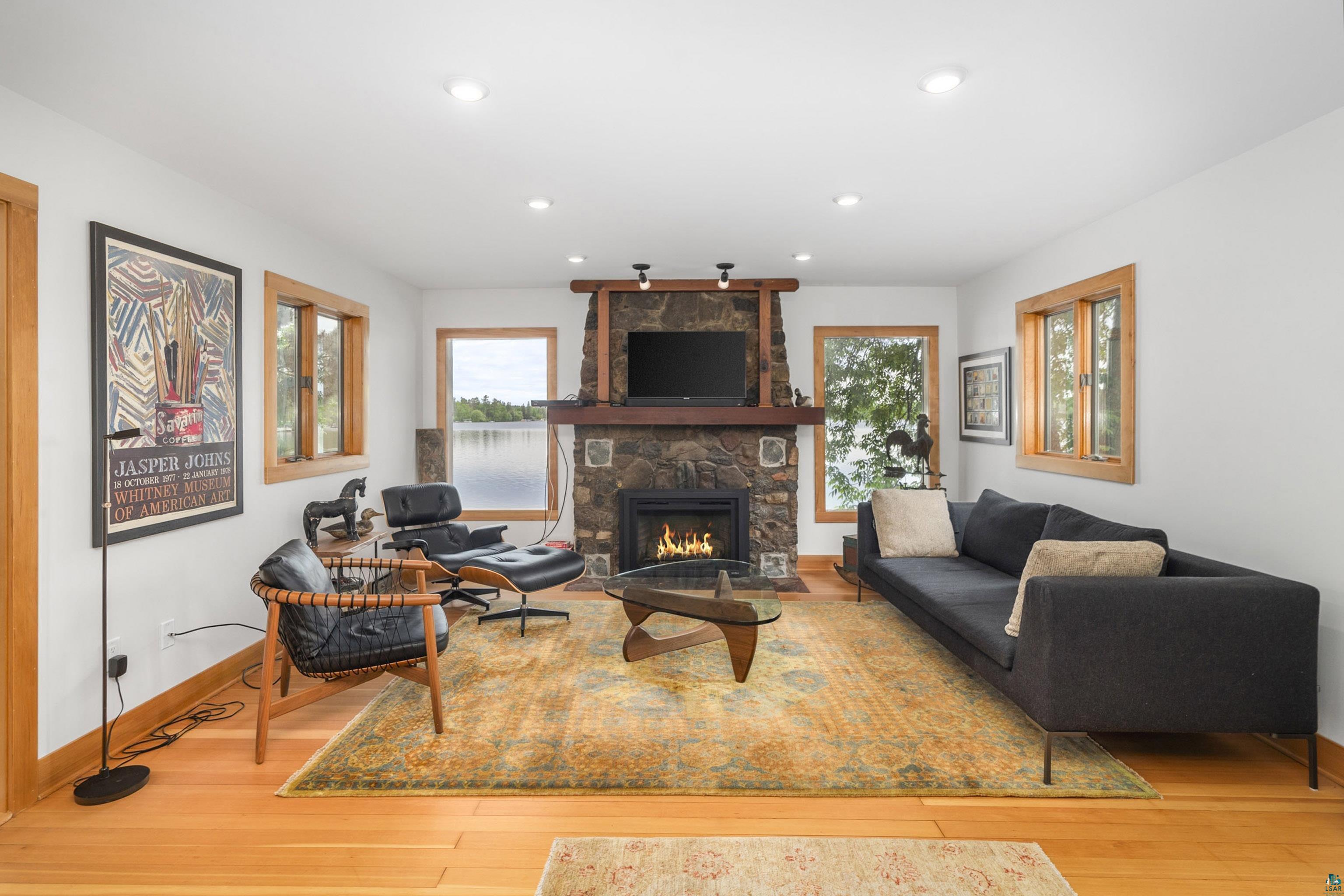 5791 South Pike Lake Road Duluth, MN 55811 - Photo 15 of 50 Living room with hardwood / wood-style flooring and a fireplace