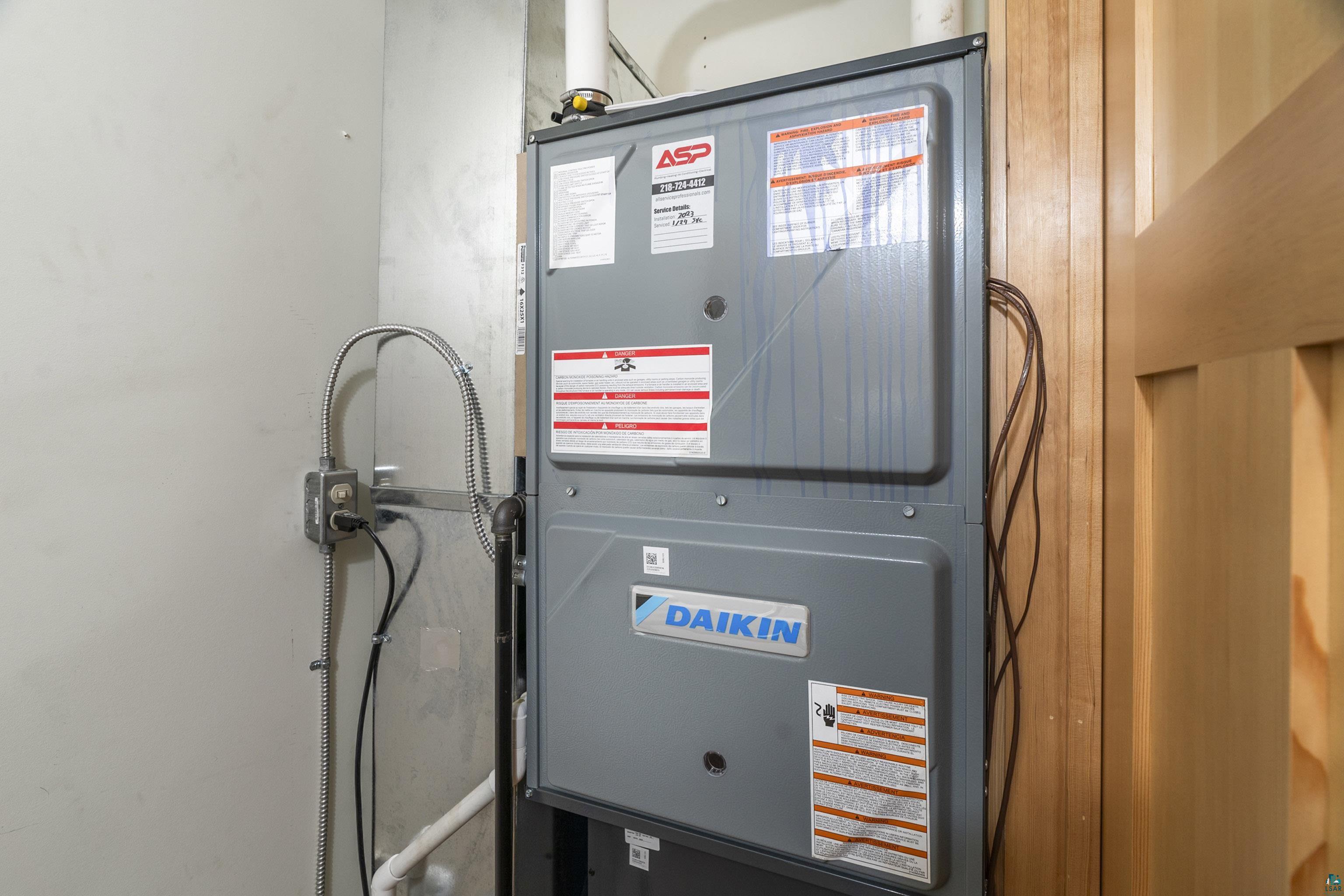 5791 South Pike Lake Road Duluth, MN 55811 - Photo 43 of 50 Utility room featuring heating utilities