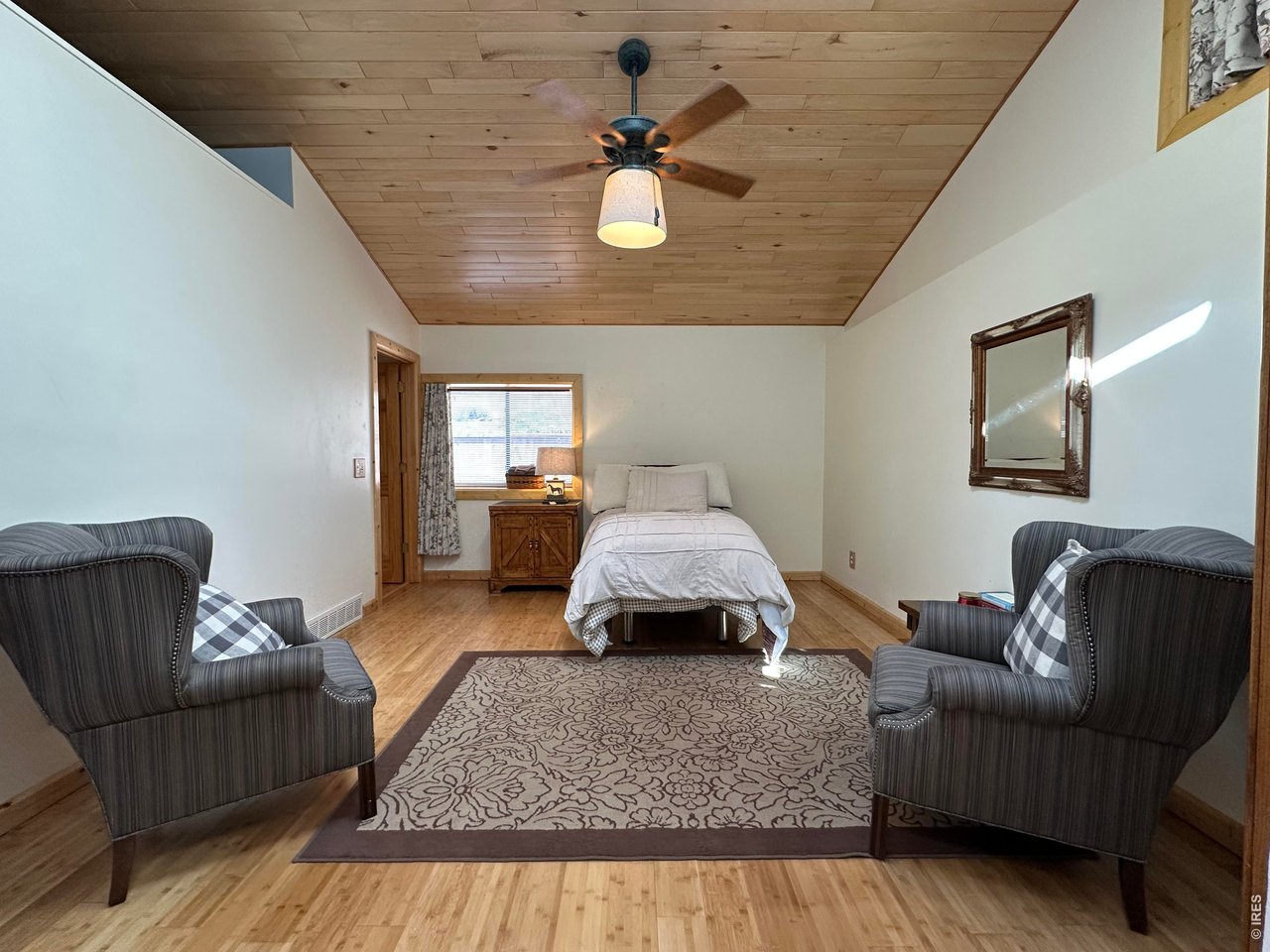 123 Mohawk Road Lyons, CO 80540 - Photo 24 of 35 a living room with furniture and a chandelier