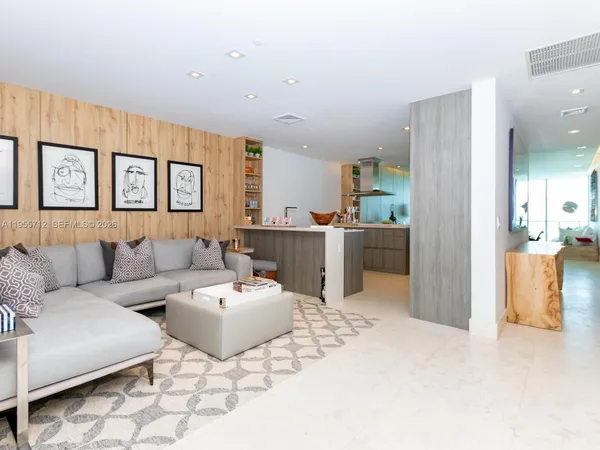 a living room with furniture and a rug