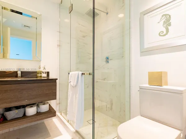 a bathroom with a tub and a shower