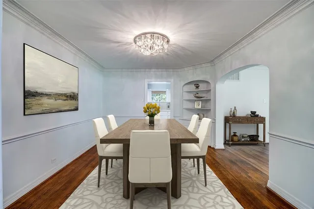 a kitchen with granite countertop a stove top oven microwave and cabinets