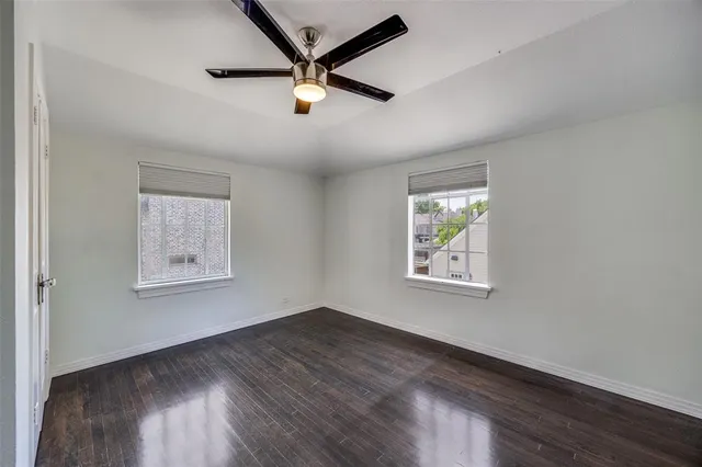 a spacious bathroom with a shower sink and mirror