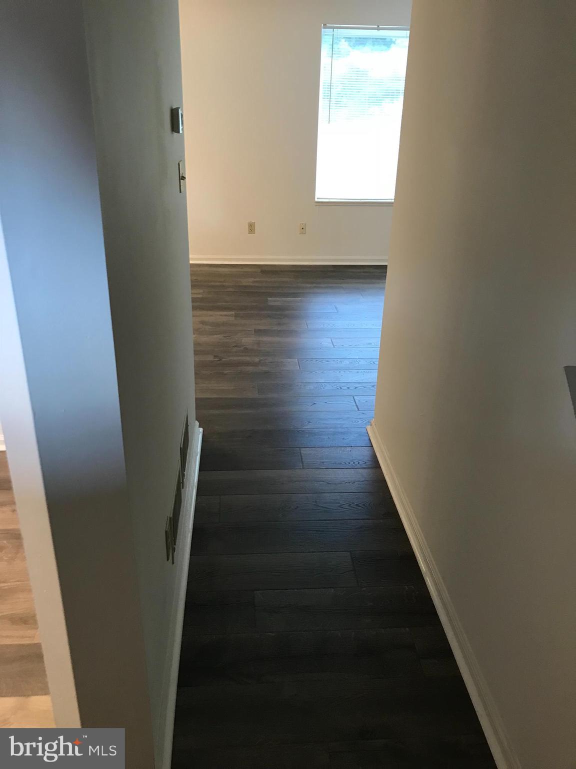 630 Front Street Lititz, PA 17543 - Photo 4 of 16 a view of a hallway with wooden floor and staircase