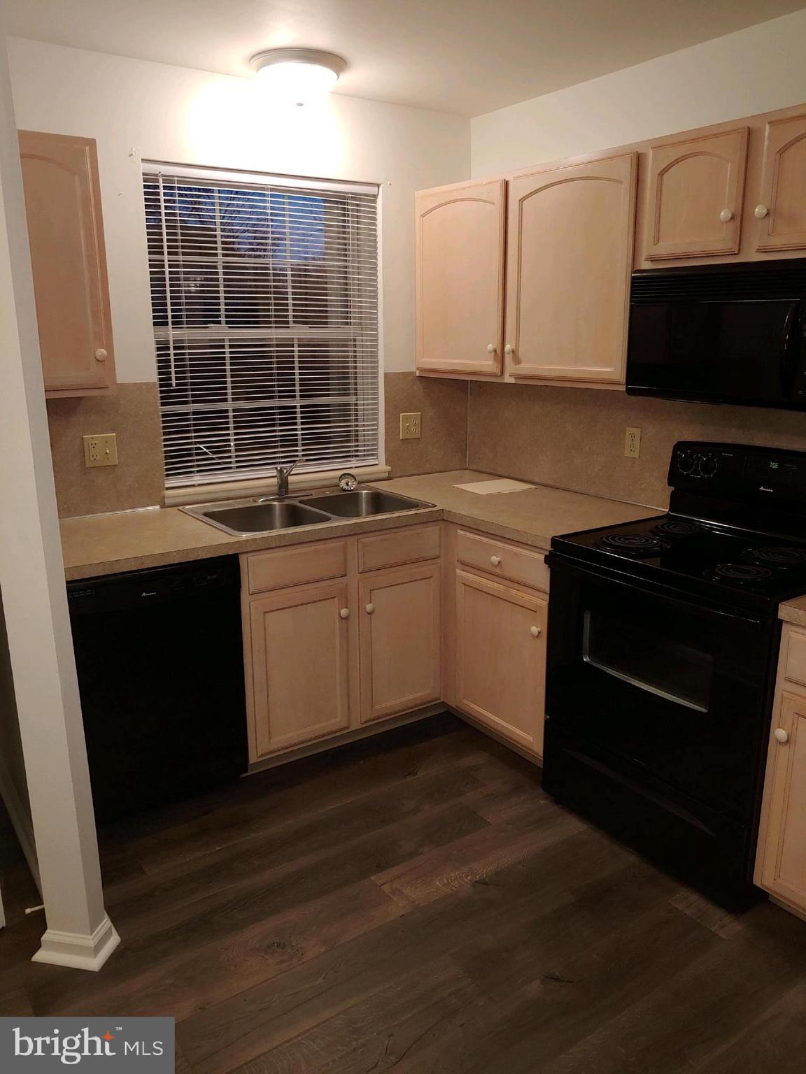 630 Front Street Lititz, PA 17543 - Photo 7 of 16 a kitchen with stainless steel appliances granite countertop a stove a sink and a microwave