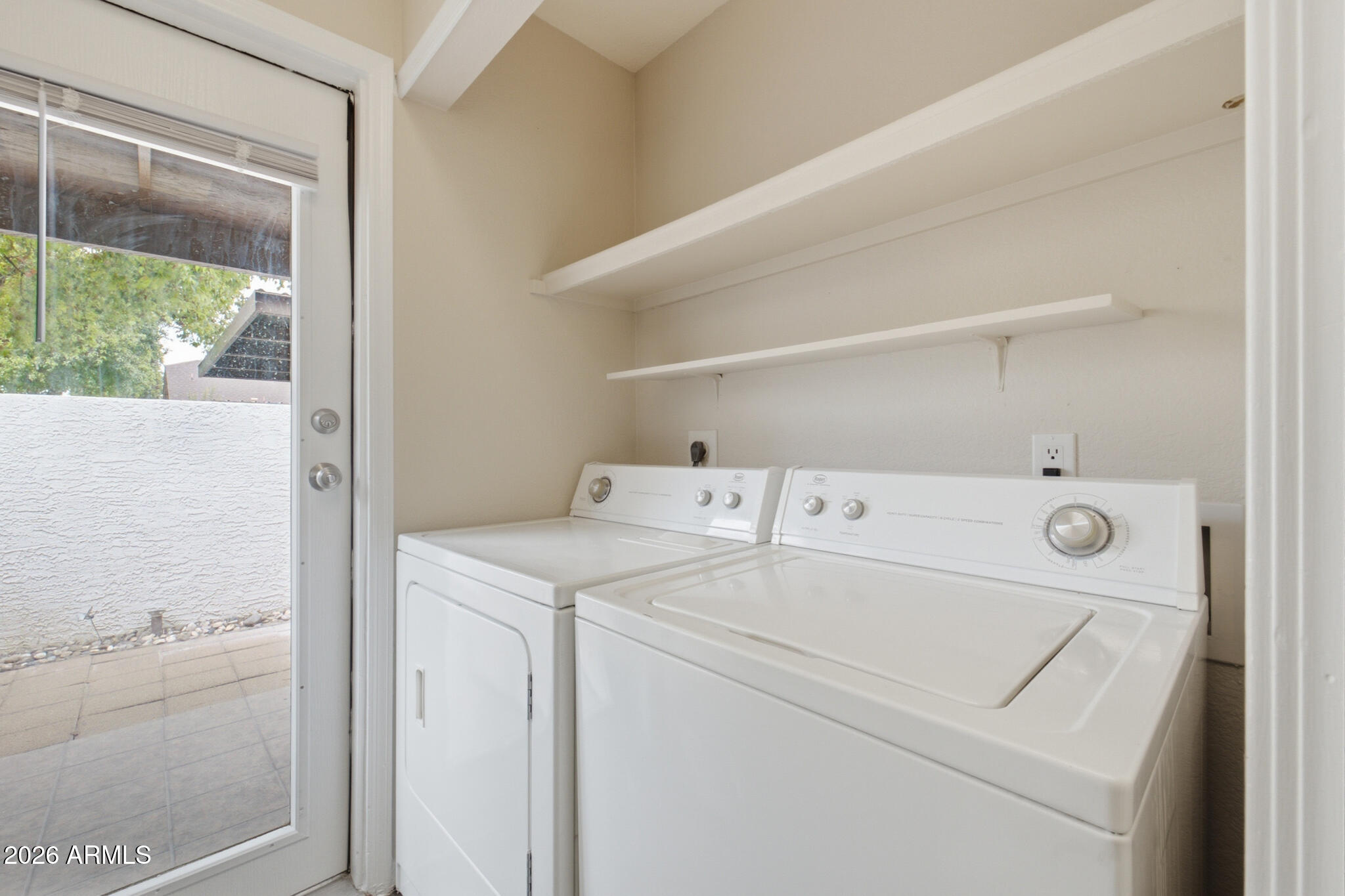 170 East Guadalupe Road, Unit 112 Gilbert, AZ 85234 - Photo 18 of 22 a utility room with dryer and washer