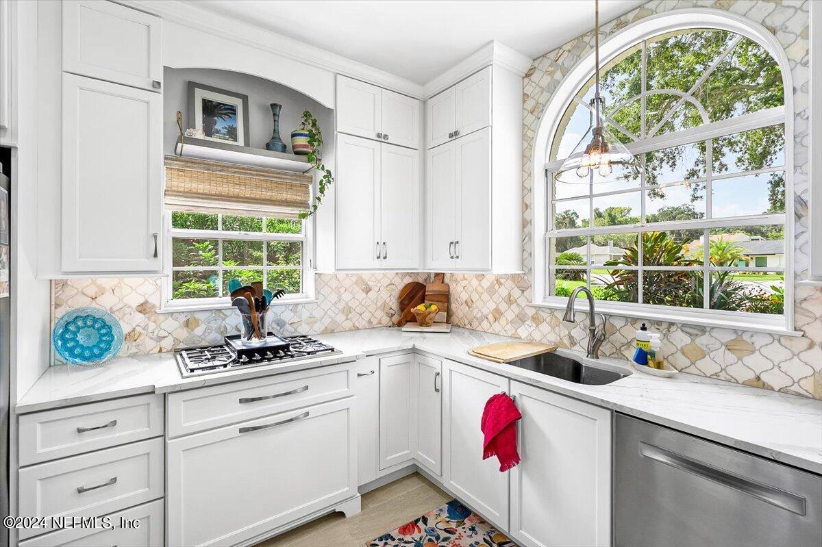 4295 Heath Road Jacksonville, FL 32277 - Photo 11 of 64 a kitchen with a white cabinets and window