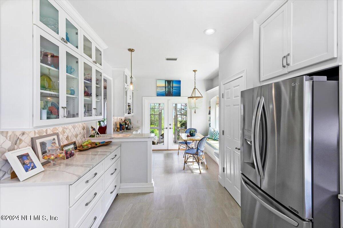 4295 Heath Road Jacksonville, FL 32277 - Photo 13 of 64 a kitchen with a refrigerator and a sink