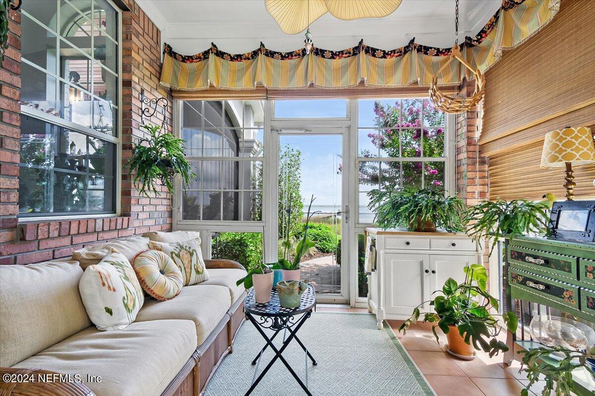 4295 Heath Road Jacksonville, FL 32277 - Photo 17 of 64 a view of a patio with couches and a potted plant