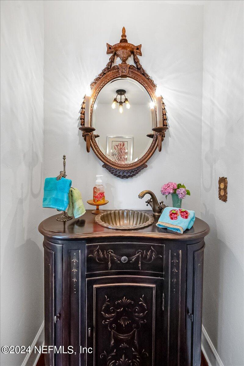 4295 Heath Road Jacksonville, FL 32277 - Photo 18 of 64 a bathroom with a sink and a mirror