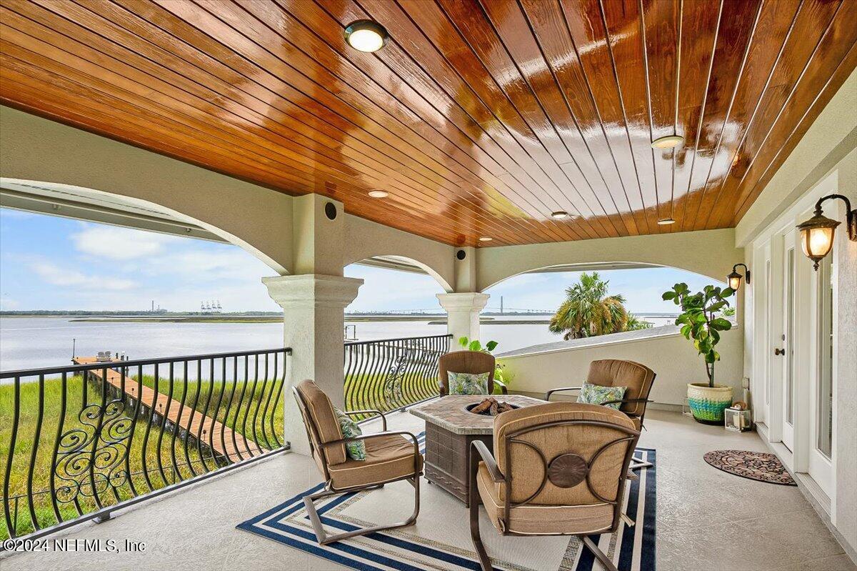 4295 Heath Road Jacksonville, FL 32277 - Photo 31 of 64 a view of balcony with furniture