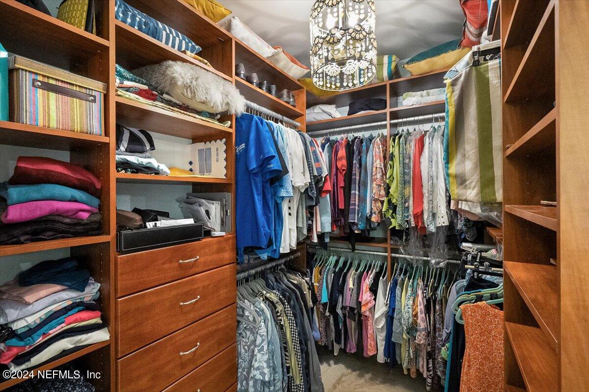 4295 Heath Road Jacksonville, FL 32277 - Photo 42 of 64 a view of walk in closet with clothes and shoes