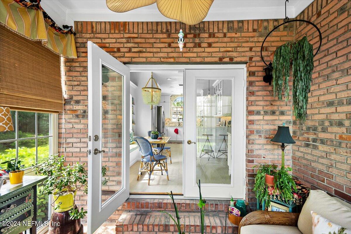 4295 Heath Road Jacksonville, FL 32277 - Photo 44 of 64 a view of a patio with plants and table and chairs
